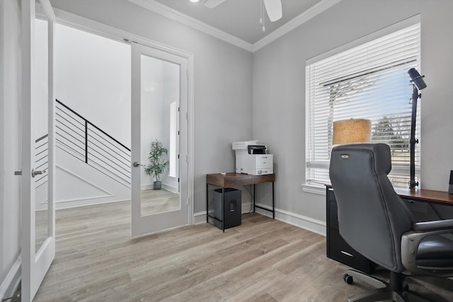 office area with a ceiling fan, baseboards, french doors, ornamental molding, and light wood-type flooring