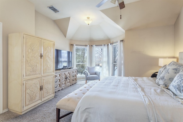 bedroom featuring ceiling fan, visible vents, vaulted ceiling, and light colored carpet