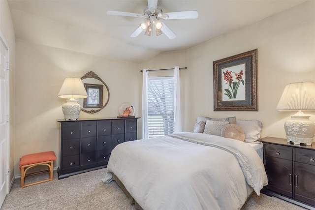 bedroom featuring vaulted ceiling, a ceiling fan, and light colored carpet