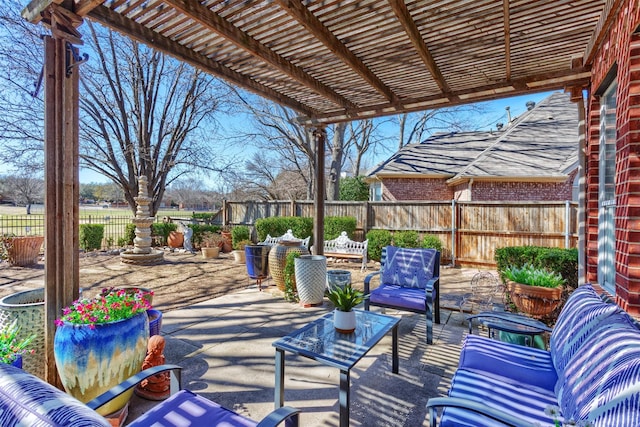 view of patio / terrace featuring a fenced backyard, an outdoor living space, and a pergola