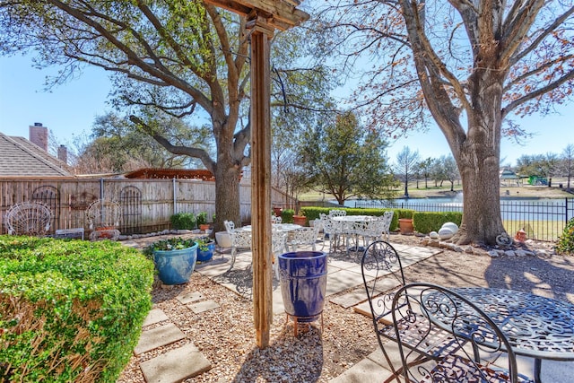 view of patio featuring outdoor dining space and a fenced backyard