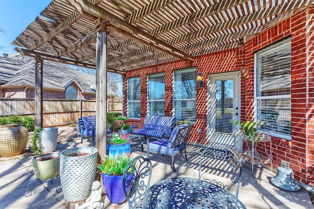 view of patio / terrace featuring fence, an outdoor living space, and a pergola