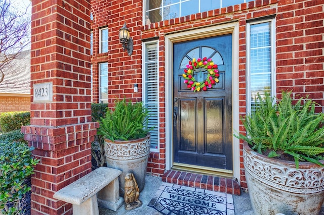 entrance to property with brick siding