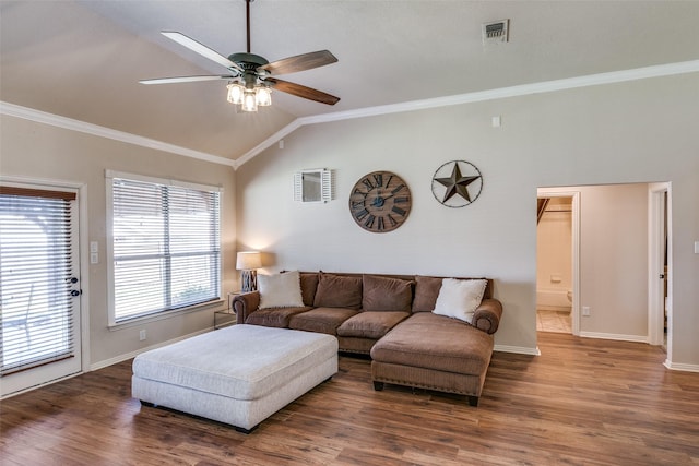 living area featuring crown molding, lofted ceiling, visible vents, ceiling fan, and wood finished floors