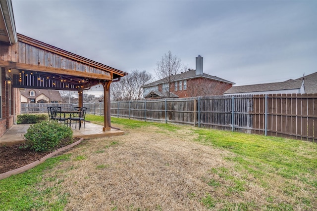 view of yard with a fenced backyard and a patio