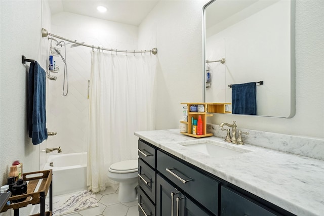 bathroom featuring vanity, shower / tub combo, and toilet