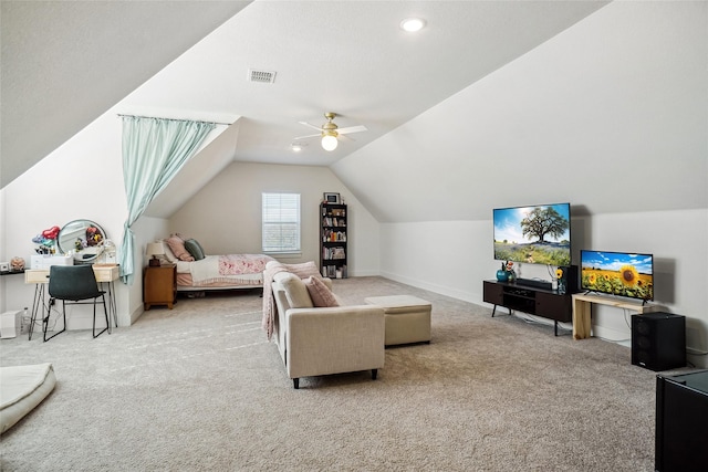carpeted living area featuring visible vents, baseboards, ceiling fan, and lofted ceiling