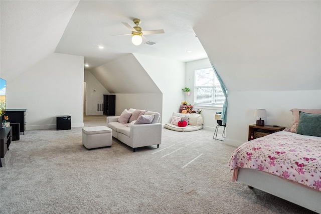 carpeted bedroom with visible vents, baseboards, ceiling fan, and vaulted ceiling