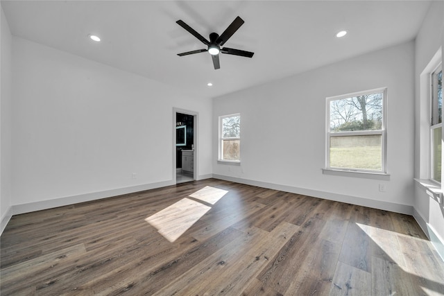 spare room featuring dark wood-style floors, baseboards, a ceiling fan, and recessed lighting