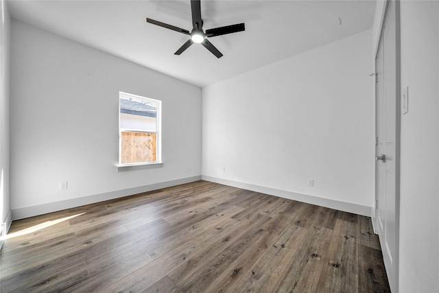 unfurnished room featuring wood-type flooring, baseboards, and ceiling fan