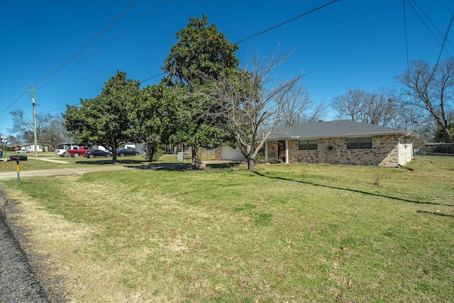 view of yard featuring an attached garage