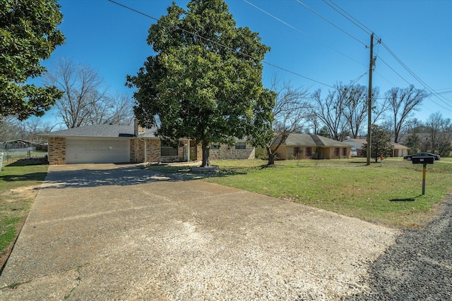 view of front of home with a garage, concrete driveway, brick siding, and a front lawn