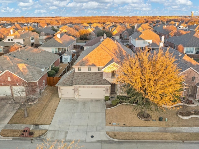 birds eye view of property with a residential view