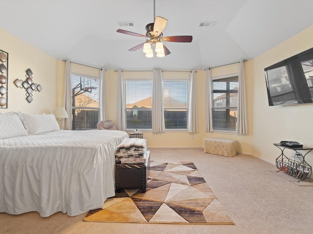 bedroom with light carpet, ceiling fan, visible vents, and baseboards