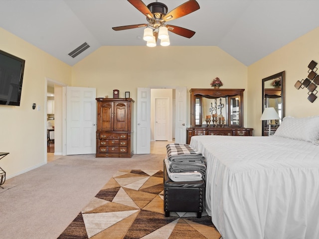 bedroom featuring baseboards, visible vents, vaulted ceiling, and light colored carpet