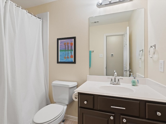 bathroom with toilet, curtained shower, vanity, and visible vents