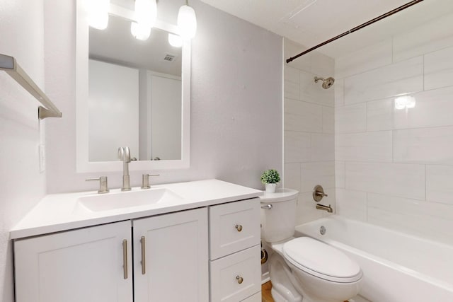 full bath featuring toilet, visible vents,  shower combination, and vanity