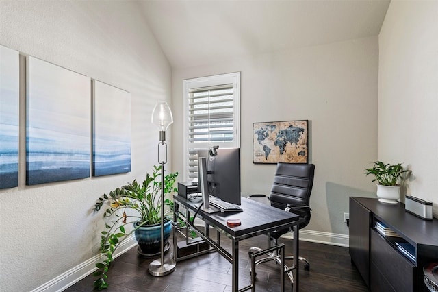 office space with dark wood-style floors, vaulted ceiling, and baseboards