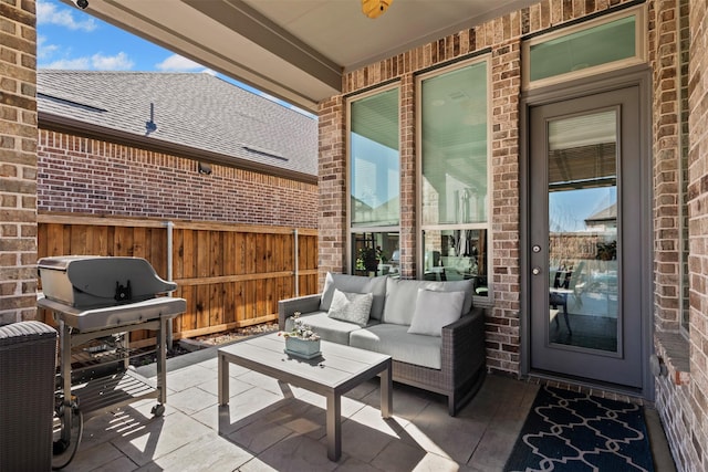 view of patio / terrace with fence and an outdoor hangout area