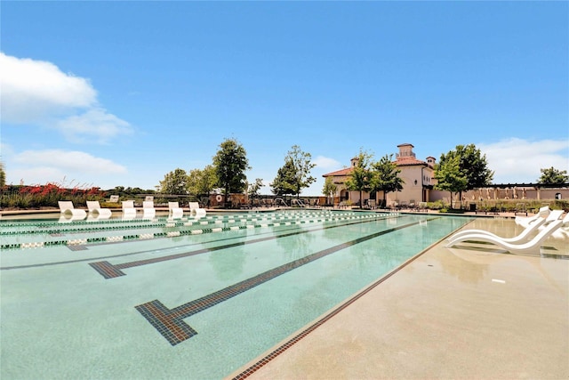 pool featuring a patio area and fence