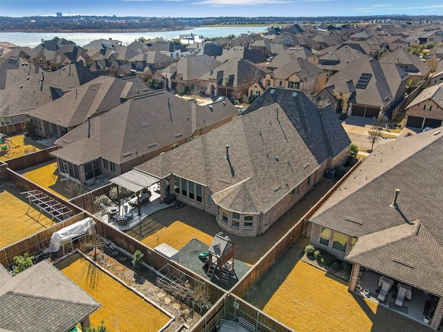 aerial view featuring a residential view and a water view