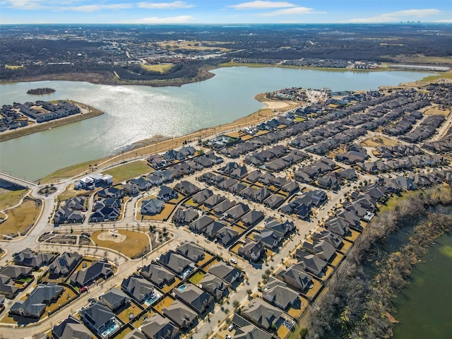 drone / aerial view with a residential view and a water view