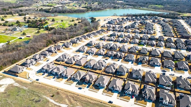 birds eye view of property with a residential view and a water view