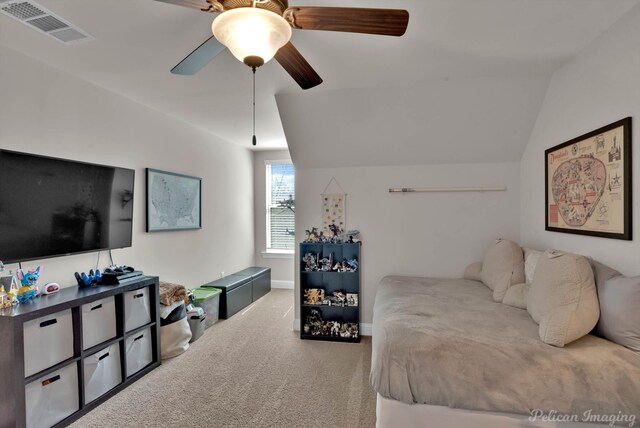 bedroom with lofted ceiling, carpet floors, visible vents, baseboards, and a ceiling fan