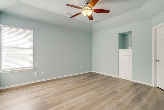 unfurnished bedroom with light wood-style flooring, visible vents, baseboards, and ceiling fan