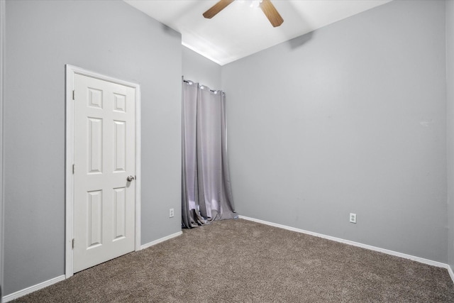 unfurnished bedroom with carpet floors, baseboards, and a ceiling fan