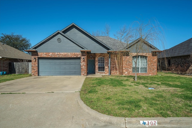 single story home featuring driveway, brick siding, a garage, and a front yard