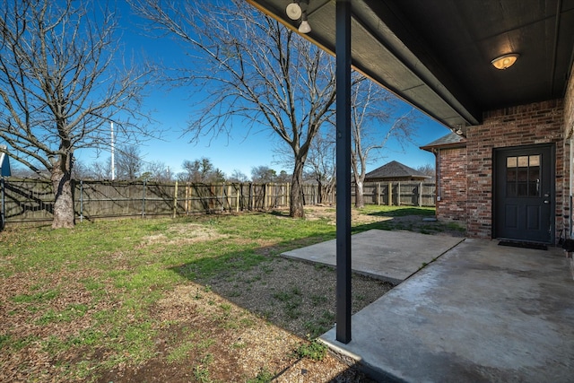 view of yard with a patio area and a fenced backyard