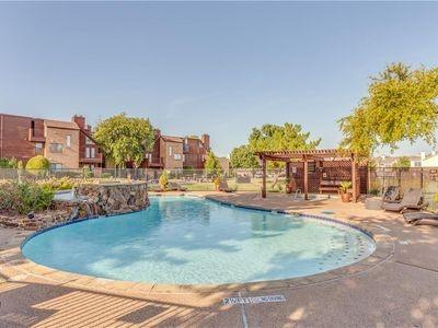 pool featuring a patio, fence, and a pergola