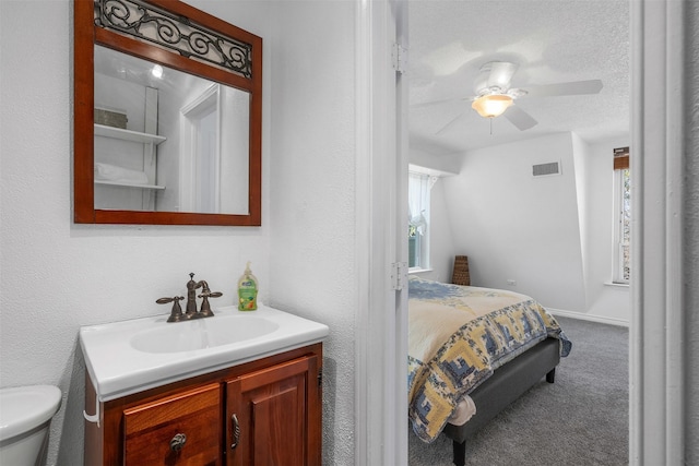 2412 Cedar Crest Dr, Granbury, TX 76048 - carpeted bedroom with visible vents, multiple windows, a sink, and a ceiling fan