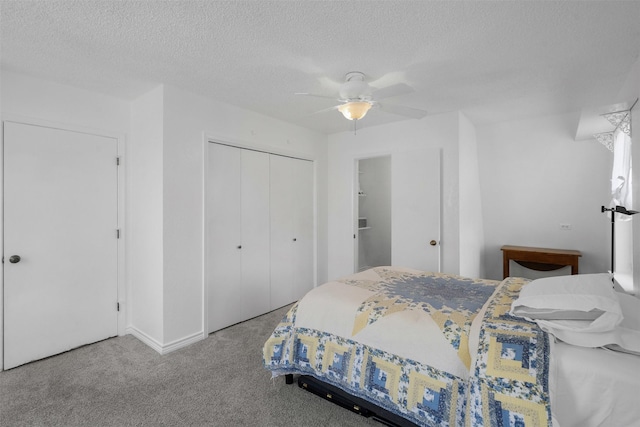 2412 Cedar Crest Dr, Granbury, TX 76048 - carpeted bedroom with a textured ceiling, a closet, and a ceiling fan