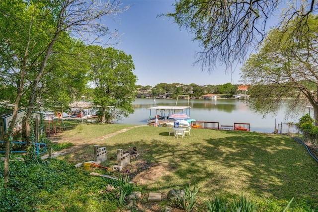 2412 Cedar Crest Dr, Granbury, TX 76048 - view of dock with a water view and a lawn