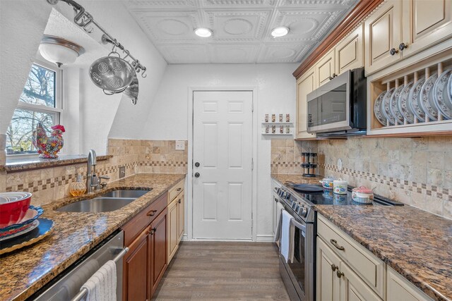 2412 Cedar Crest Dr, Granbury, TX 76048 - kitchen with tasteful backsplash, an ornate ceiling, stainless steel appliances, a sink, and wood finished floors