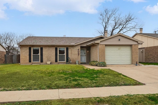 ranch-style house with an attached garage, brick siding, fence, concrete driveway, and a front lawn