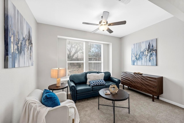 living room featuring a ceiling fan, carpet flooring, visible vents, and baseboards