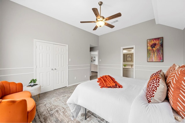 bedroom with carpet floors, visible vents, a ceiling fan, vaulted ceiling, and a closet