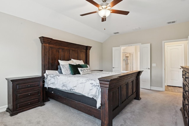 bedroom featuring baseboards, visible vents, vaulted ceiling, and light colored carpet