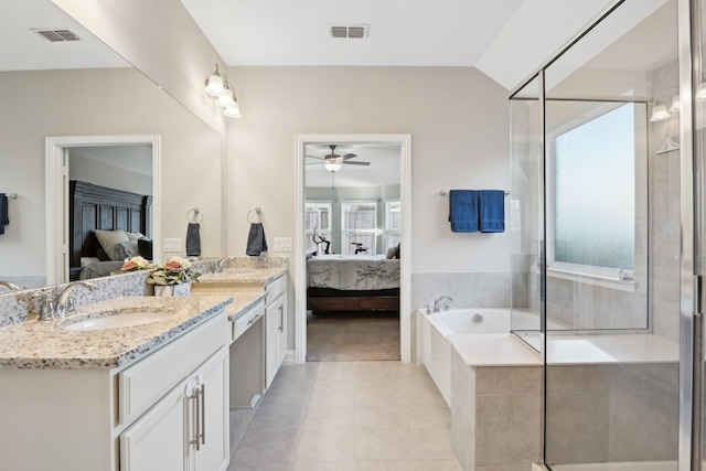 full bath featuring visible vents, connected bathroom, a sink, and double vanity