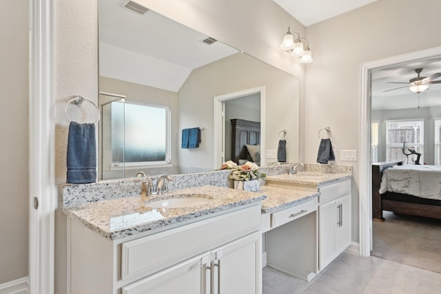 ensuite bathroom with double vanity, visible vents, a ceiling fan, connected bathroom, and a sink