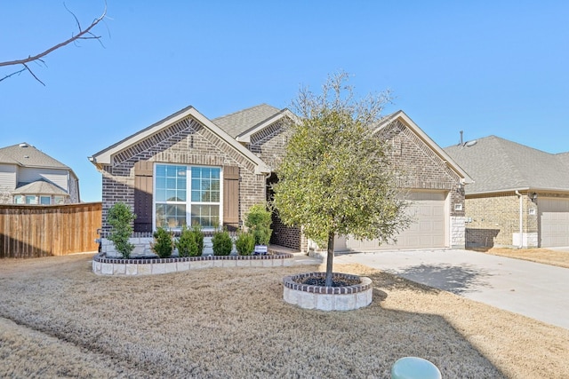 view of front of house featuring a shingled roof, concrete driveway, an attached garage, fence, and brick siding