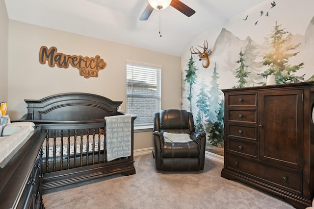 bedroom featuring a ceiling fan, carpet, lofted ceiling, and baseboards