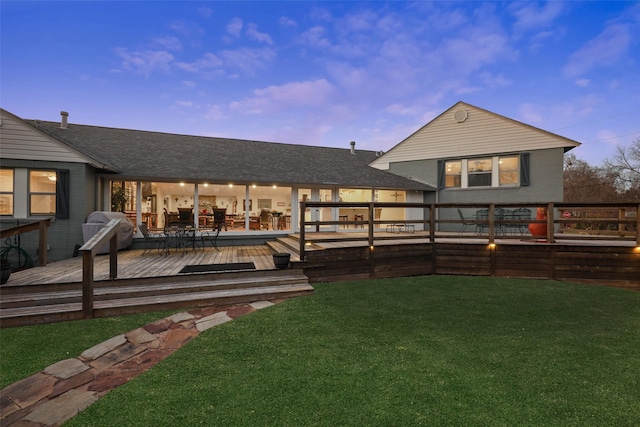 928 N Irving Heights Dr, Irving, TX 75061 - rear view of house with a deck, brick siding, a lawn, and a shingled roof