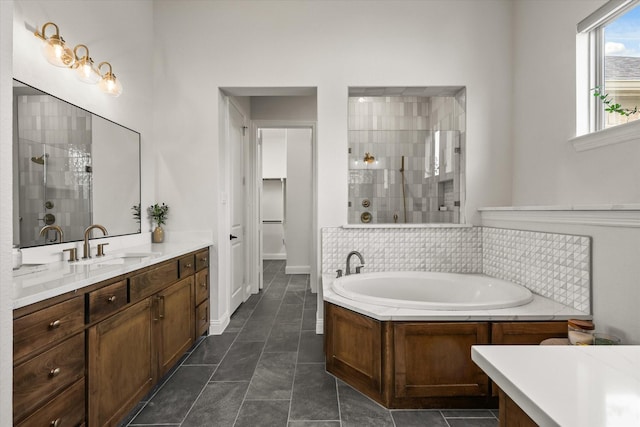 full bathroom with tasteful backsplash, a tile shower, vanity, tile patterned flooring, and a bath