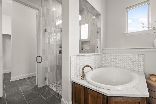 bathroom with a stall shower and a bath