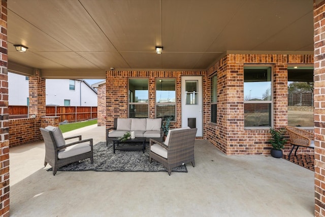 view of patio with fence and an outdoor hangout area