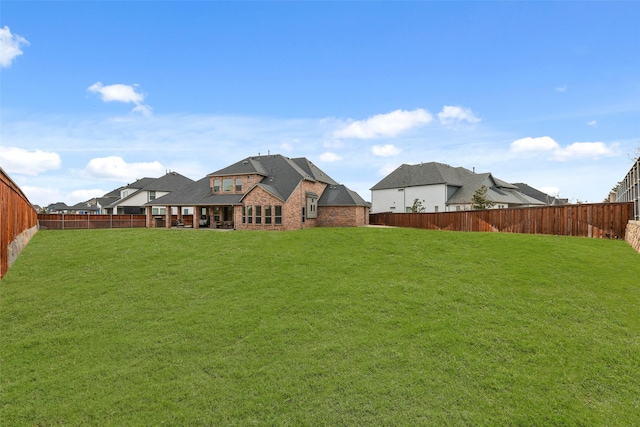 view of yard featuring a fenced backyard